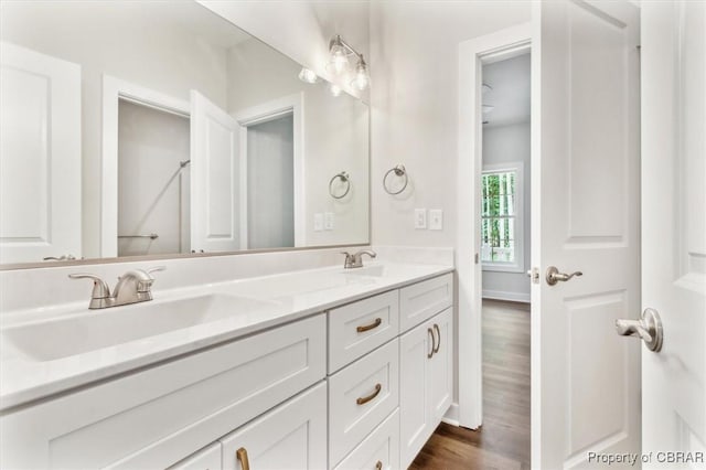 5883 Mill Race Pl, Gloucester, VA 23061 - bathroom featuring double vanity and wood finished floors