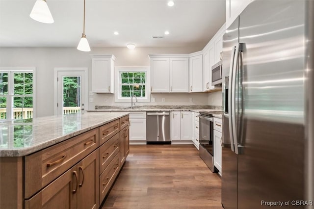 5883 Mill Race Pl, Gloucester, VA 23061 - kitchen featuring stainless steel appliances, white cabinets, dark wood-type flooring, light stone counters, and recessed lighting