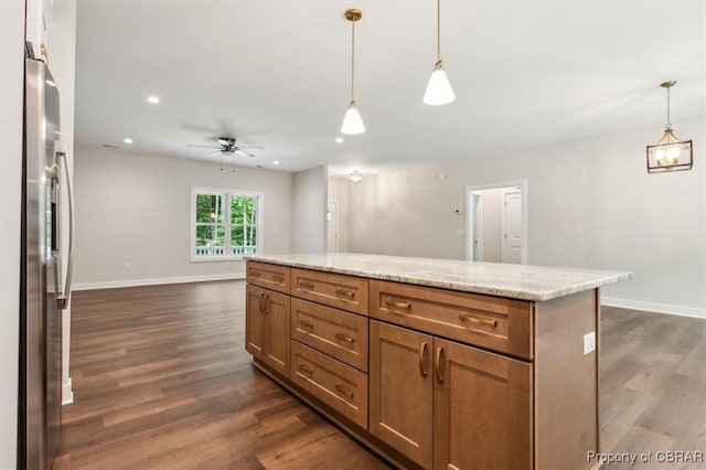 5883 Mill Race Pl, Gloucester, VA 23061 - kitchen with stainless steel fridge, dark wood-type flooring, ceiling fan, a center island, and open floor plan