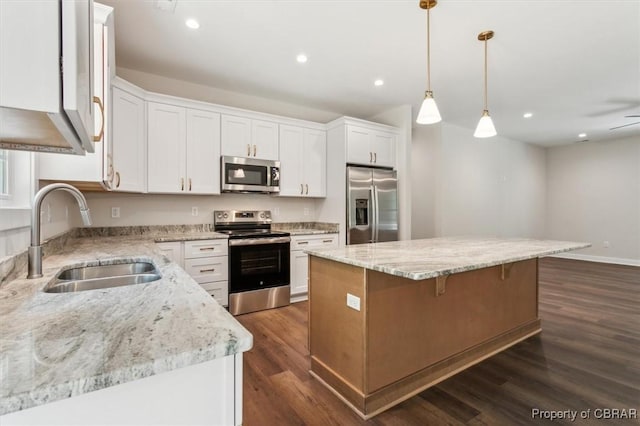 5883 Mill Race Pl, Gloucester, VA 23061 - kitchen featuring appliances with stainless steel finishes, a center island, dark wood-style flooring, white cabinets, and recessed lighting