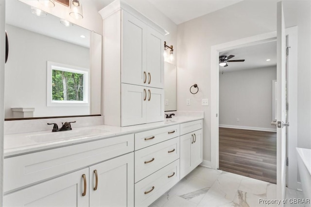 5883 Mill Race Pl, Gloucester, VA 23061 - full bathroom with double vanity, a ceiling fan, recessed lighting, and marble finish flooring