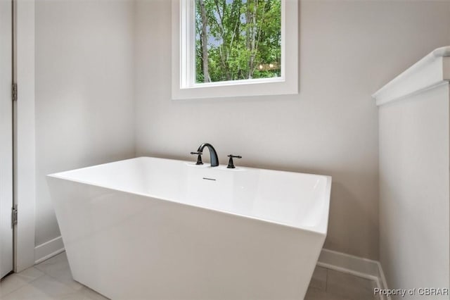 5883 Mill Race Pl, Gloucester, VA 23061 - full bathroom with a soaking tub and tile patterned flooring