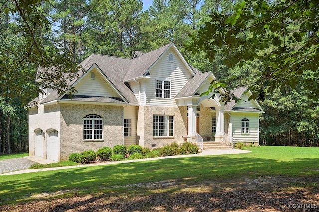 3007 Tranbycroft Way, Sandy Hook, VA 23153 - view of front of property featuring brick siding, a front lawn, a shingled roof, a garage, and driveway