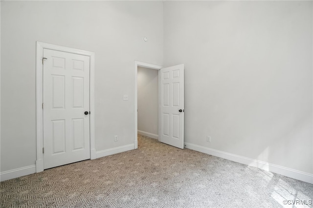 3007 Tranbycroft Way, Sandy Hook, VA 23153 - unfurnished bedroom featuring carpet flooring and a towering ceiling