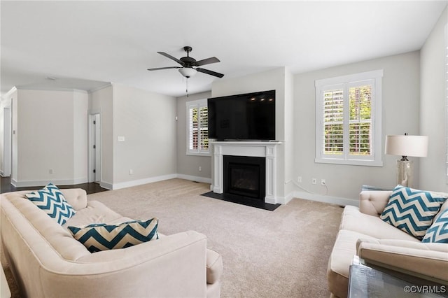 12613 Capernwray Ter, Chesterfield, VA 23838 - carpeted living area with a ceiling fan and a fireplace with flush hearth