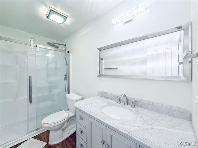 7908 Capistrano Dr, Henrico, VA 23227 - bathroom featuring vanity, wood finished floors, and a shower stall