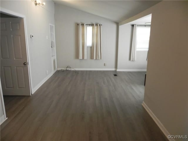 6325 Maple Rd, Quinton, VA 23141 - spare room with vaulted ceiling and dark wood-style floors