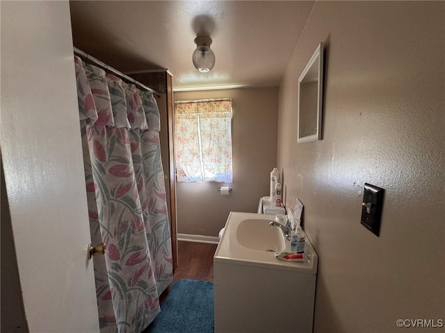 875 Islington Rd, Warsaw, VA 22572 - full bath with vanity, wood finished floors, and curtained shower