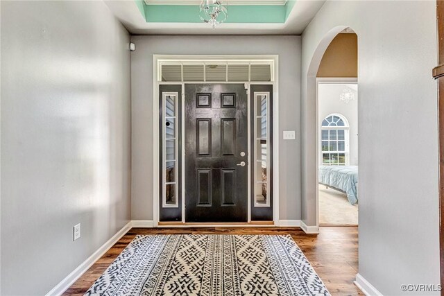 5858 Pilmour Dr, Providence Forge, VA 23140 - foyer entrance with wood finished floors and arched walkways