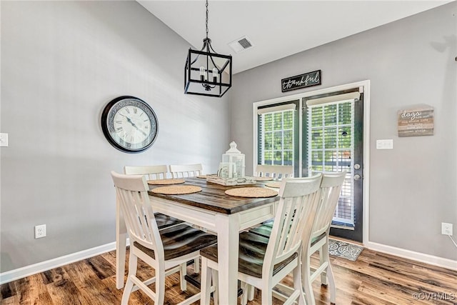 5858 Pilmour Dr, Providence Forge, VA 23140 - dining area featuring a chandelier and wood finished floors