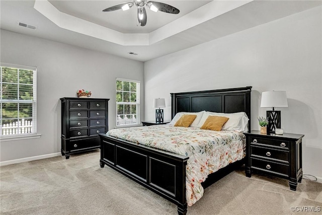 5858 Pilmour Dr, Providence Forge, VA 23140 - bedroom with light colored carpet, a tray ceiling, and a ceiling fan