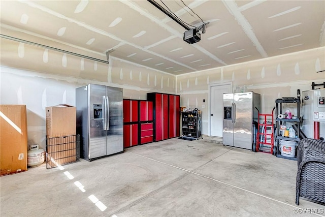 5858 Pilmour Dr, Providence Forge, VA 23140 - garage with stainless steel fridge with ice dispenser, a garage door opener, and water heater