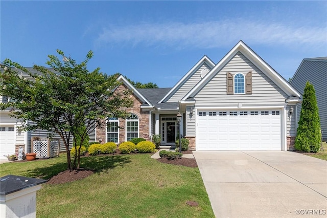 5858 Pilmour Dr, Providence Forge, VA 23140 - view of front of property with a front lawn, driveway, stone siding, and an attached garage