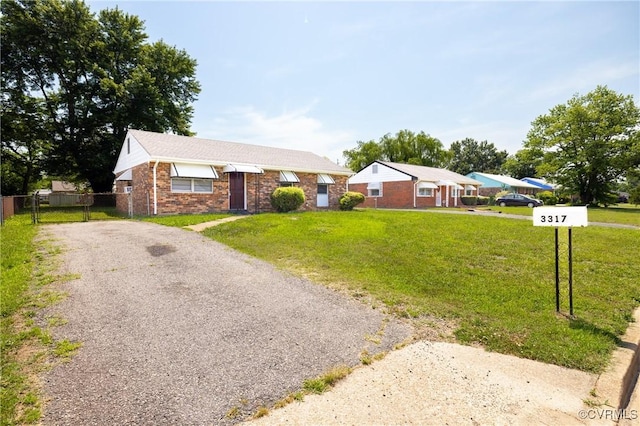 3317 Gaulding Ln, Richmond, VA 23223 - ranch-style house featuring brick siding and asphalt driveway