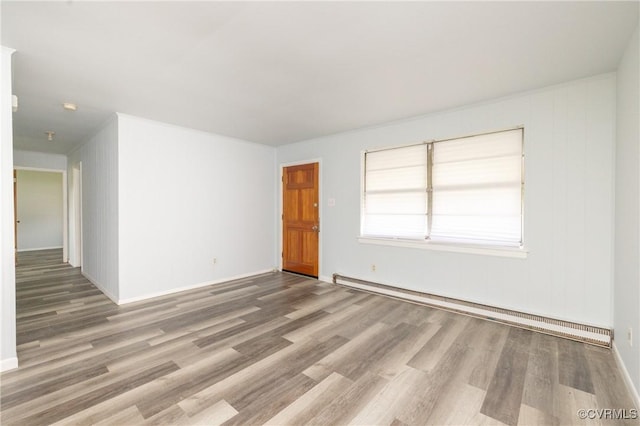 3317 Gaulding Ln, Richmond, VA 23223 - spare room featuring a baseboard heating unit and wood finished floors