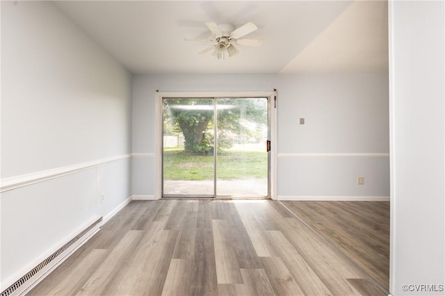 3317 Gaulding Ln, Richmond, VA 23223 - empty room with a baseboard radiator, wood finished floors, and ceiling fan