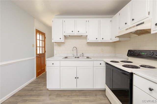 3317 Gaulding Ln, Richmond, VA 23223 - kitchen featuring electric stove, under cabinet range hood, white cabinets, tasteful backsplash, and light countertops