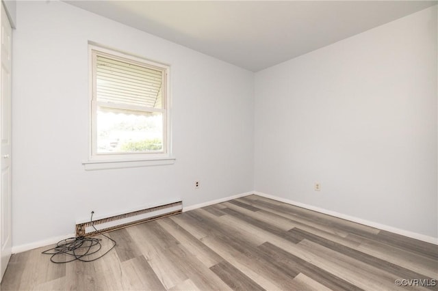 3317 Gaulding Ln, Richmond, VA 23223 - unfurnished room with a baseboard heating unit and wood finished floors