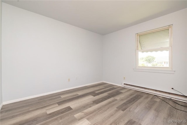 3317 Gaulding Ln, Richmond, VA 23223 - spare room featuring a baseboard radiator and wood finished floors