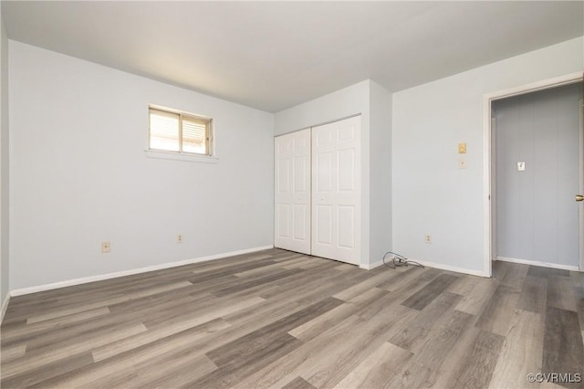 3317 Gaulding Ln, Richmond, VA 23223 - unfurnished bedroom with wood finished floors and a closet