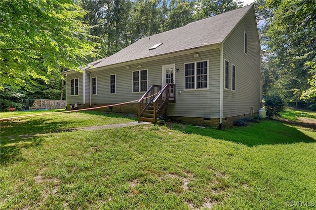5129 Jenkins Forest Ln, Sandston, VA 23150 - back of property with crawl space, a lawn, and a shingled roof