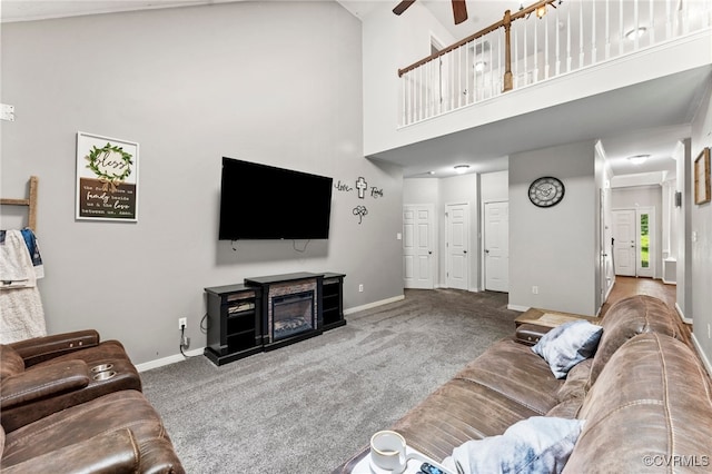 5129 Jenkins Forest Ln, Sandston, VA 23150 - carpeted living room featuring a ceiling fan and a high ceiling