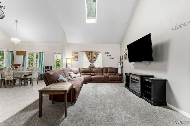 5129 Jenkins Forest Ln, Sandston, VA 23150 - living room featuring high vaulted ceiling, a chandelier, a skylight, and carpet