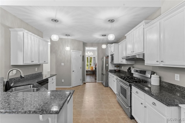 5129 Jenkins Forest Ln, Sandston, VA 23150 - kitchen with stainless steel appliances, under cabinet range hood, white cabinets, and dark stone counters