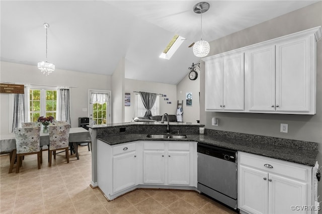 5129 Jenkins Forest Ln, Sandston, VA 23150 - kitchen with stainless steel dishwasher, lofted ceiling, white cabinets, a peninsula, and dark stone countertops