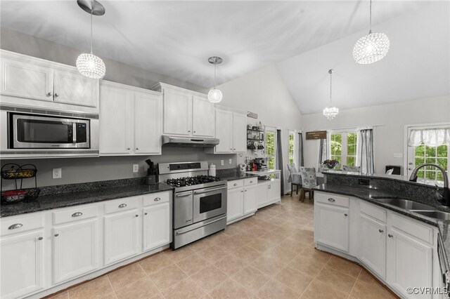5129 Jenkins Forest Ln, Sandston, VA 23150 - kitchen featuring stainless steel appliances, a chandelier, under cabinet range hood, white cabinets, and hanging light fixtures