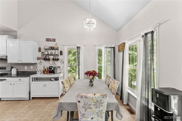 5129 Jenkins Forest Ln, Sandston, VA 23150 - dining area featuring a chandelier, high vaulted ceiling, and light tile patterned flooring