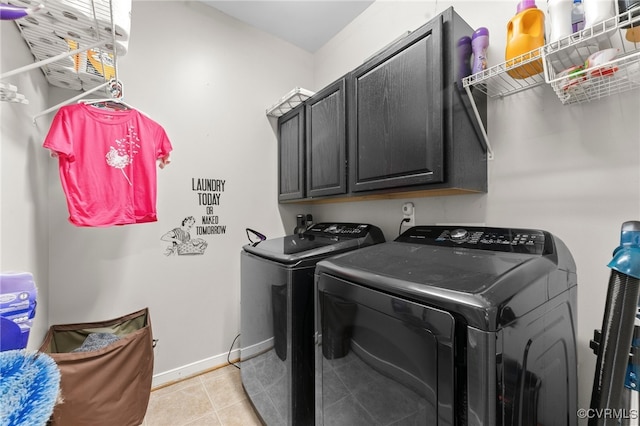 5129 Jenkins Forest Ln, Sandston, VA 23150 - laundry room with washing machine and clothes dryer, cabinet space, and light tile patterned flooring
