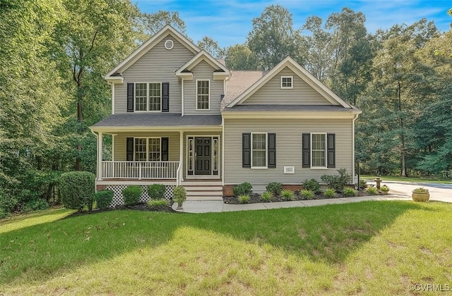 5129 Jenkins Forest Ln, Sandston, VA 23150 - view of front facade with a porch and a front lawn