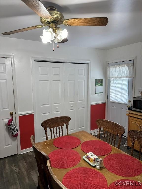 24501 River Rd, North Dinwiddie, VA 23803 - dining room featuring a ceiling fan and dark wood-type flooring