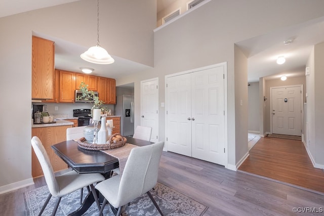 1014 Pennsylvania Ave, Glen Allen, VA 23060 - dining room featuring a high ceiling and dark wood-type flooring