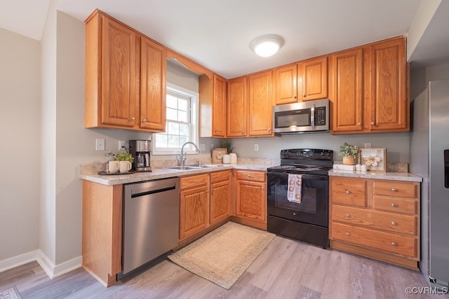 1014 Pennsylvania Ave, Glen Allen, VA 23060 - kitchen with appliances with stainless steel finishes, light wood-type flooring, and light countertops