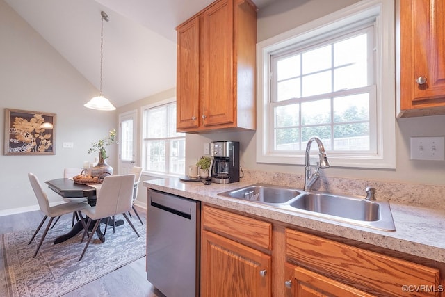 1014 Pennsylvania Ave, Glen Allen, VA 23060 - kitchen featuring dishwasher, light countertops, wood finished floors, lofted ceiling, and brown cabinets