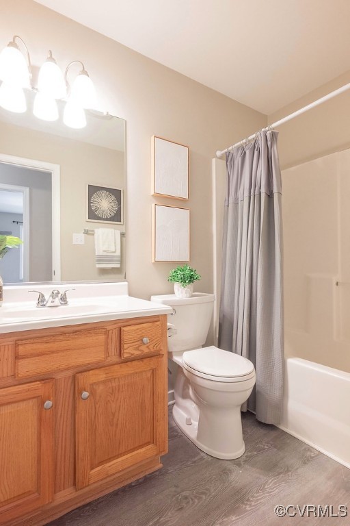 1014 Pennsylvania Ave, Glen Allen, VA 23060 - bathroom with wood finished floors, vanity, and shower / tub combo with curtain