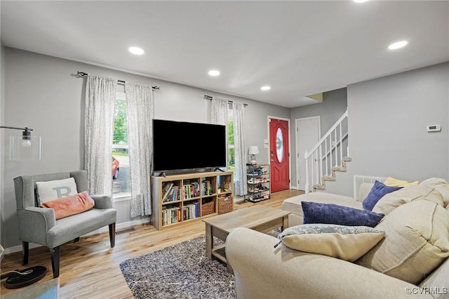 4606 S Run Ct, Chesterfield, VA 23234 - living room featuring light wood finished floors, healthy amount of natural light, recessed lighting, and stairway