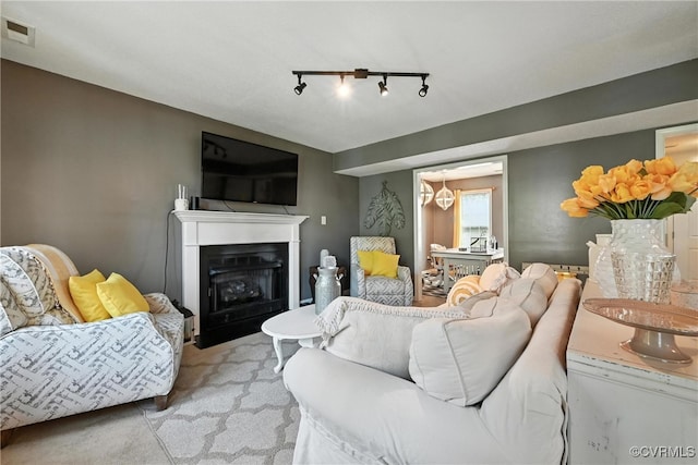 3006 Creek Meadow Cir, North Chesterfield, VA 23234 - living room with light carpet, a fireplace with flush hearth, and rail lighting
