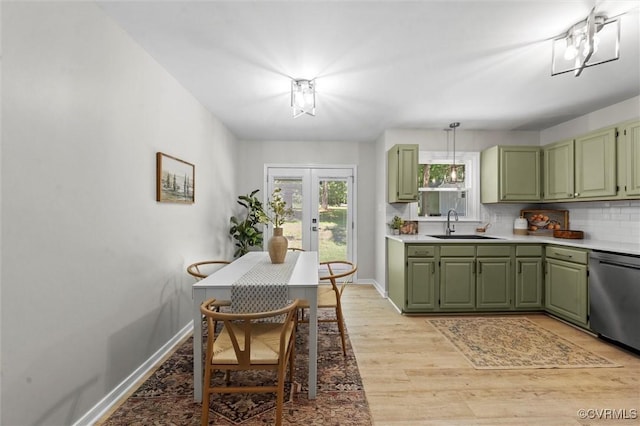 1900 Pine Creek Bluff Ct, Powhatan, VA 23139 - kitchen with green cabinetry, stainless steel dishwasher, french doors, and light countertops