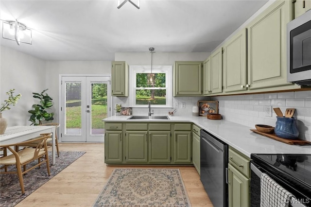 1900 Pine Creek Bluff Ct, Powhatan, VA 23139 - kitchen with green cabinetry, appliances with stainless steel finishes, and decorative backsplash