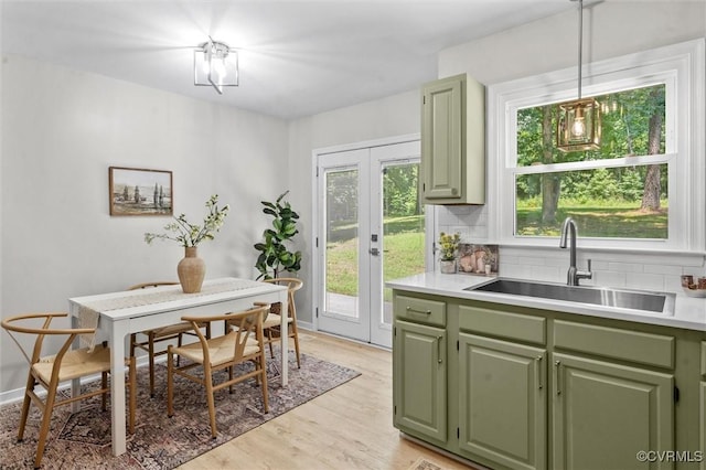 1900 Pine Creek Bluff Ct, Powhatan, VA 23139 - dining room with french doors and light wood-style flooring