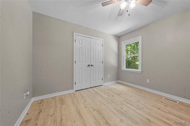 1900 Pine Creek Bluff Ct, Powhatan, VA 23139 - unfurnished bedroom featuring light wood-style flooring, a closet, and a ceiling fan