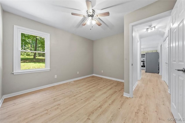 1900 Pine Creek Bluff Ct, Powhatan, VA 23139 - empty room featuring light wood-style floors and a ceiling fan