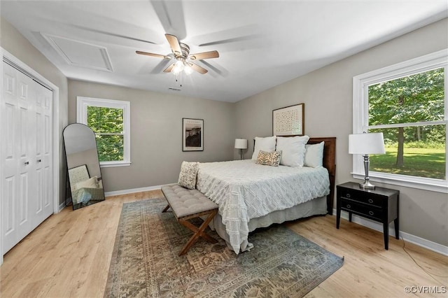 1900 Pine Creek Bluff Ct, Powhatan, VA 23139 - bedroom featuring light wood-type flooring, a ceiling fan, a closet, and attic access