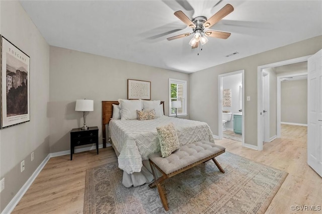 1900 Pine Creek Bluff Ct, Powhatan, VA 23139 - bedroom featuring light wood-style flooring, connected bathroom, and ceiling fan