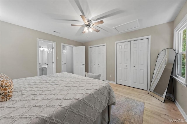 1900 Pine Creek Bluff Ct, Powhatan, VA 23139 - bedroom featuring attic access, light wood-style floors, multiple closets, a ceiling fan, and connected bathroom