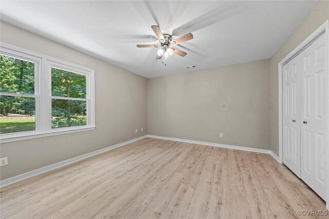 1900 Pine Creek Bluff Ct, Powhatan, VA 23139 - unfurnished bedroom featuring light wood-style flooring, a closet, and a ceiling fan
