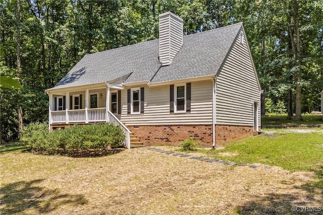 1900 Pine Creek Bluff Ct, Powhatan, VA 23139 - view of front facade with a porch, a front lawn, a chimney, and roof with shingles